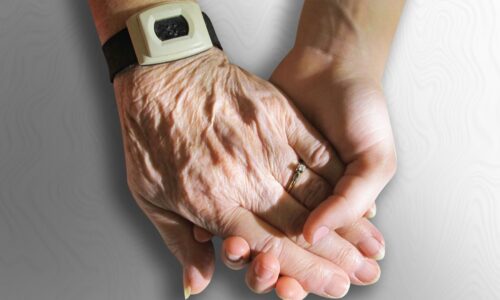 介護業界 悩み を抱えるスタッフが給料、人間関係、激務に悩んでいる様子と、それを解決するための対策イメージ